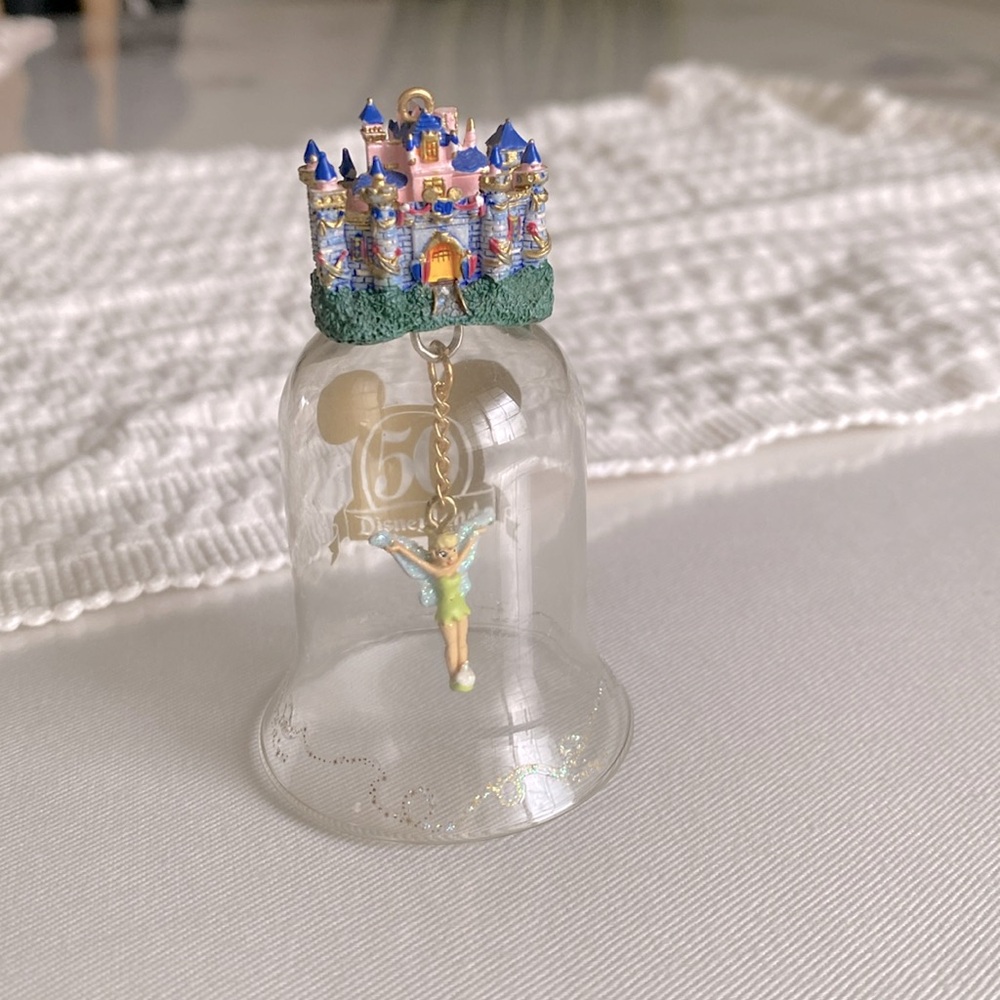 Disneyland’s 50th Anniversary Tinkerbell glass bell with castle collectible